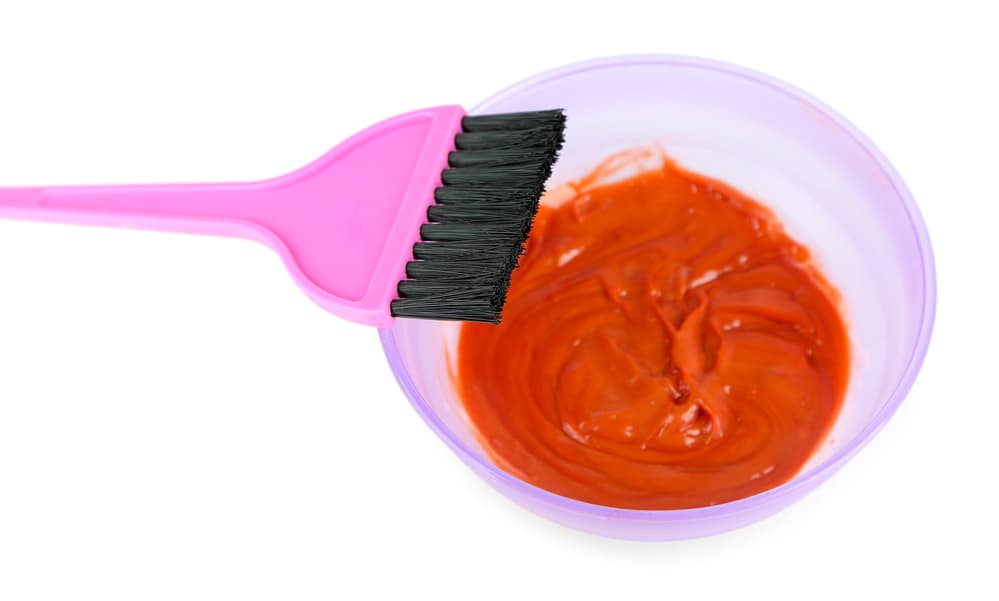 How to get hair dye out of carpet. A bowl of dye and a brush.