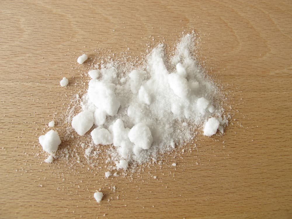 Powdered ammonia on a wooden table
