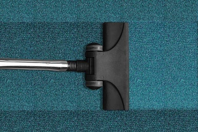 Vacuum head cleaning a Milliken carpet