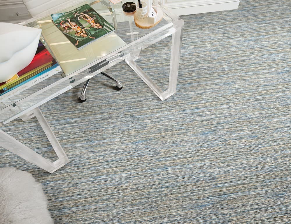 Bamboo blend carpet beneath a transparent desk