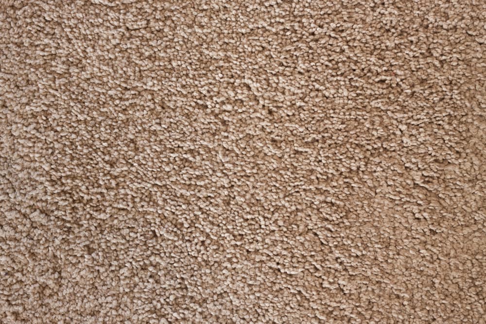 beige synthetic fiber carpet