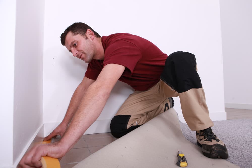 handyman installing carpet