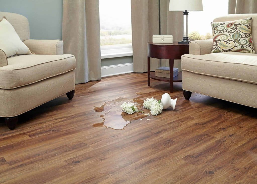 beige nucore flooring with water from a vase spilled